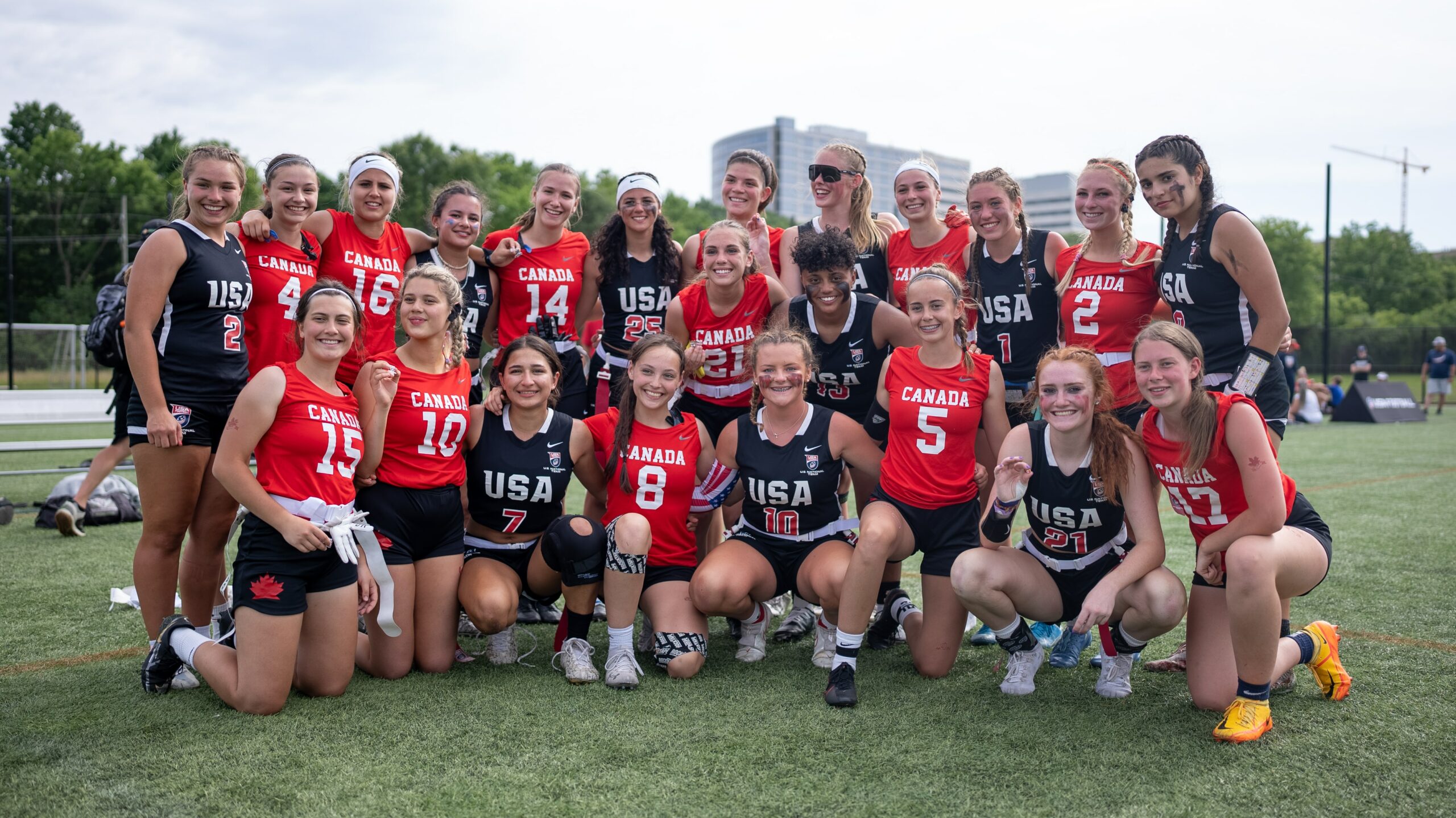 2022 U.S. 17U Girls' Flag National Team posing with a team from Canada at the 2022 Junior Flag International Cup
