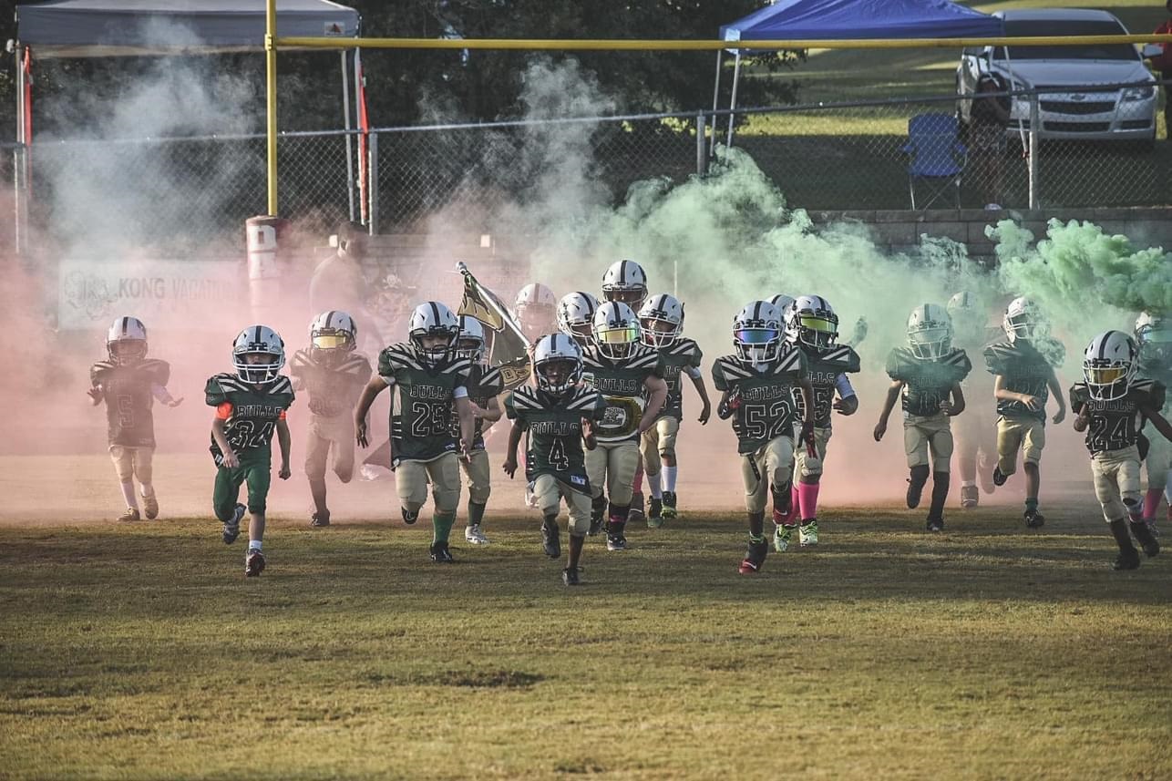 Youth football players take the field